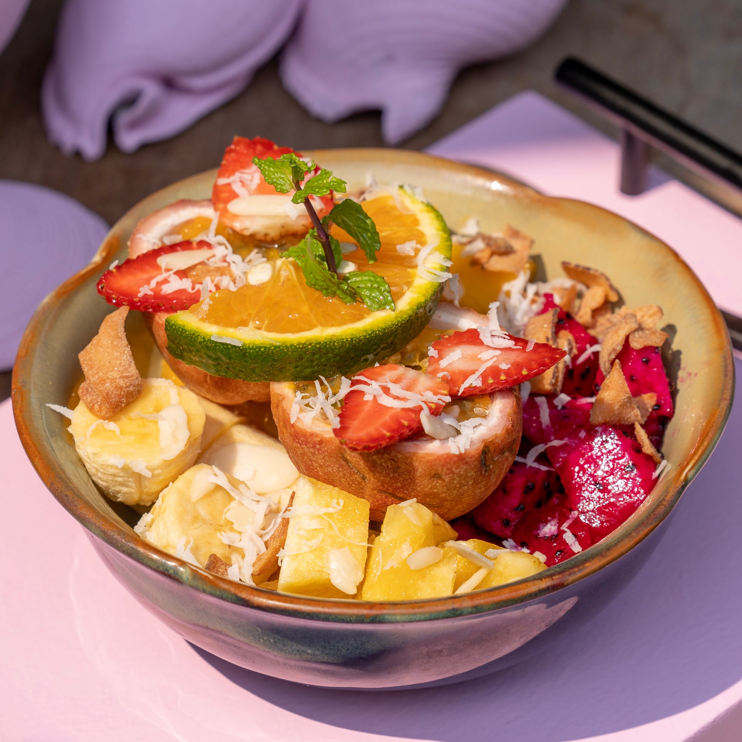 Island Breeze Fruit Bowl with a seasonal selection of finest sun-ripened local fruits, elevated with a premium topping of toasted coconut flakes and sweet shredded coconut at YESH! Tribe | Eat & Vibe in Hoi An